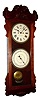 New Haven Clock Co., New Haven, Conn., "Rutland" wall clock, 30 day, time and calendar, spring driven movement in a mahogany case with painted metal dials, c1914