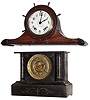 Clocks- 2 (Two), 8 day, time and strike, American mantel clocks: Kroeber "Lombardia" enameled and marbleized iron case; and Seth Thomas Clock Co., Thomaston, Conn., "W Stellar" yacht-wheel mahogany tambour; c1888 and 1945