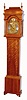 Aaron Miller, Elizabethtown, N.J. tall clock, 8 day, time and bell strike, weight driven movement with typical Miller wooden winding drums, arch cutout to lower section and clipped upper left corner of plates in gumwood case [stained cherry color]  with with brass dial, cast brass spandrels and silvered chapter ring, date aperture above 6 and disc with maker's signature in the arch, c1750