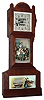 Yale Clock Co., New Haven, CT,  miniature eight day time only tall clock advertising Reeds Gilt Edge Tonic, movement unsigned, paper dial on zinc plate, blued steel hands, beveled glass in upper door, lower glass panels with lithographed cards, one a family scene, with Wishing You a Merry Christmas written at the bottom, the bottom illustrated with a painting, and vase and bowl with flowers, cherry case with incised decoration c1890