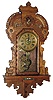 Seth Thomas Clock Co., Thomaston, Conn., 8 day, time and strike/alarm hanging gingerbread wall clock, c1905.