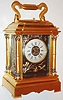 France, for Bigelow, Kennard and Co., carriage clock, gilt brass Anglaise Riche variant case with Corinthian columns, the capitals and bases with patinated silver and multicolor gold ornament, panels, dial center and dial mask with dark patinated ground with foliate and insect decoration in the Japanesque style, silvered Roman numeral dial signed Bigelow, Kennard and Co. Boston, blued steel Breguet style hands, eight day grand sonnerie movement with lever platform.