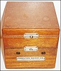 Hamilton Watch Co., Lancaster, Penn., model 22 deck watch, 35 size, 21 jewel, two day movement with cotes de Geneve decoration, matte silver Arabic numeral dial signed Hamilton Lancaster Pa., U.S.A., blued steel hands, plastic crystal, mahogany box with gimbals and locking lever, plate on front of box marked Hamilton Watch Co., Lancaster Pa., U.S.A, c1950