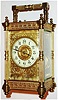 France, eight day time, strike and hour repeating carriage clock, lever platform, white enamel Arabic numeral dial, blued steel hands, gilt dial mask and center with acanthus leaf engraving, polished pillars style case with turned feet and finials, with a matte gilt blind fret at the case top and bottom, and beveled glass panels c1900