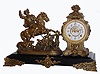 Ansonia Clock Co., New York, NY, "BOAR HUNTER" figural clock, showing the hunter mounted horseback with a long spear ready to lance the boar, now cornered by the dog, c1894