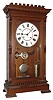 Seth Thomas Clock Co., Thomaston, Conn., "Garfield" mantel clock, 8 day, time and strike, weight driven movement in a walnut case with painted metal dial, damascened nickel plate pendulum bob and brass weights, c1890