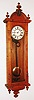 Ansonia Clock Co., New York, NY, "Capitol" wall clock, 8 day, time and strike, spring driven movement in an oak case with paper dial, c1900