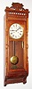 Ansonia Clock Co., New York, NY, "Santa Fe" wall clock, 8 day, time only, two brass weight driven movement in an oak case with painted metal dial, c1904