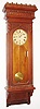 Wm. L. Gilbert Clock Co., Winsted, Conn., "Regulator No. 11" wall clock, 8 day, time only, two brass weight driven movement in a walnut case with paper dial, c1900