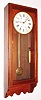 E. Howard and Co., Boston, Mass., industrial-style wall clock, 8 day, weight driven, time only movement in a mahogany case with painted metal dial, mov't circa 1900, case unknown.