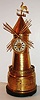 French Industrial, windmill, the polished brass case with black marble base, mid section with pierced gallery, topped with a weathervane, lower section with two simulated windows flanking a door, which slides up to allow separate windmill movement to be wound, with eight day time only movement with cylinder platform, silvered Roman numeral dial with gilt center, and blued steel spade hands, c1870