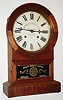 Hadley Bros. and Estell, Chicago, Ill., 8 day, time and strike clock with a complicated arrangement of pins on a wheel in the back of the movement to allow timing of many events.  It was invented by Samuel F. Estell.  A very unusual clock, c1874.