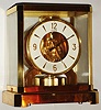 Jaeger-LeCoultre Swiss "Atmos" table clock, jeweled movement runs on changes of atmospheric pressure and temperature, gold-plated brass and glass case, serial number 132565, c1962.