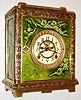 New Haven Clock Co., New Haven, Conn., "No. 1017" model, Asian influenced cast bronze case with green Aesthetic period Chelsea art tiles manufactured by J and G Low, Chelsea, Mass., the tiles depicting clouds, hovering and flying putti, and an hourglass, white enamel Arabic numeral dial, blued steel hands, cast bezel with beveled glass, 8 day, time and strike, movement with Brocot open escapement, c1885