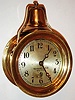 Boston Clock Co., for Tiffany and Co., N.Y., ships bell clock with 8 day tandem wind movement, both time and strike mainsprings wound by a single arbor, lever escapement, the front plate marked McMillans Pat., and numbered 98, silvered brass Arabic numeral dial marked "Tiffany and Co., New York", blued steel moon hands, heavy round brass case with lacquered surface, screw bezel, and bell mounted on top c1890