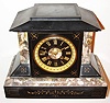 France, Belgian slate mantel clock with multi colored marble moldings, gilt incised vine, leaf and line decoration, black slate dial with gilt incised Roman numerals, signed "Harmann and Koch New York", gilt hands, gilt bezel with thick beveled glass, 8 day, time and strike, pendule a Paris movement signed Marti, c1880