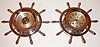 Chelsea Clock Co., Boston, Mass., ships bell clock and barometer in polished nickel finish yacht wheel cases, eight day time and ships bell strike movement with silvered Arabic numeral dial, black finished steel moon hands, the barometer with matching case and silvered dial, and blued steel hand, c1975