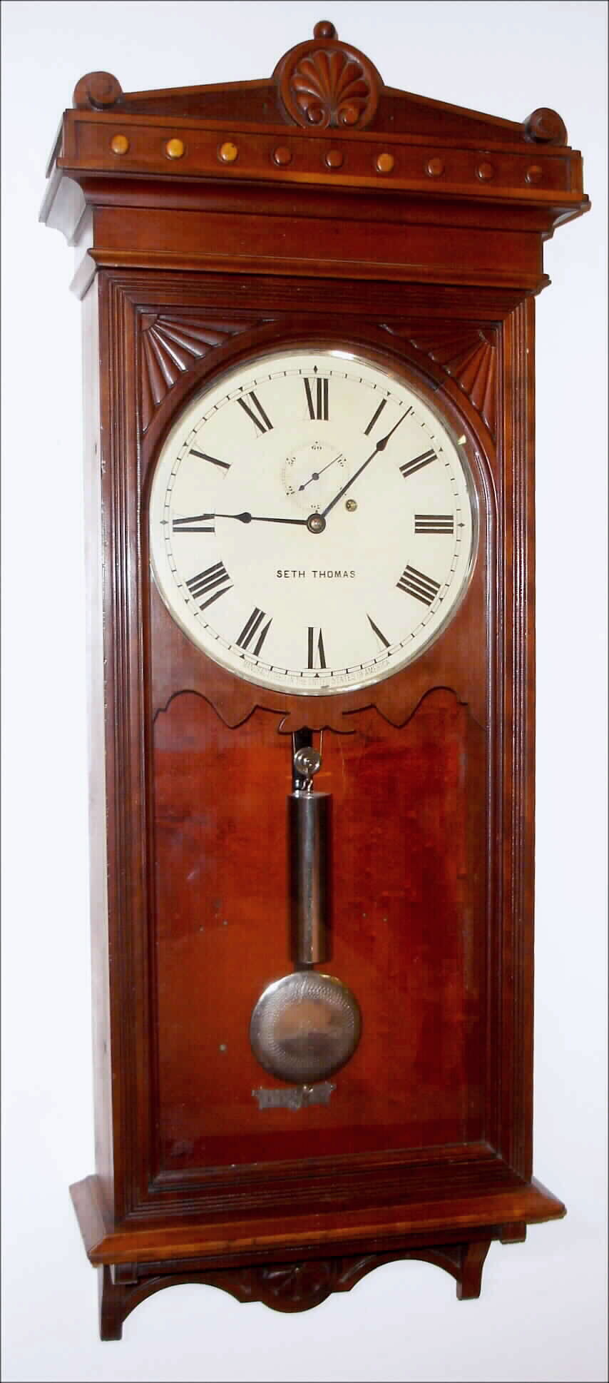 Seth Thomas Clock Co., Thomaston, Conn., "Regulator No. 30", 8 day, time only, weight driven movement with nickel plated pulley, weight, pendulum bob, indicator and hinges, in cherry case with painted metal dial, c1880 — Antique Clocks Price Guide