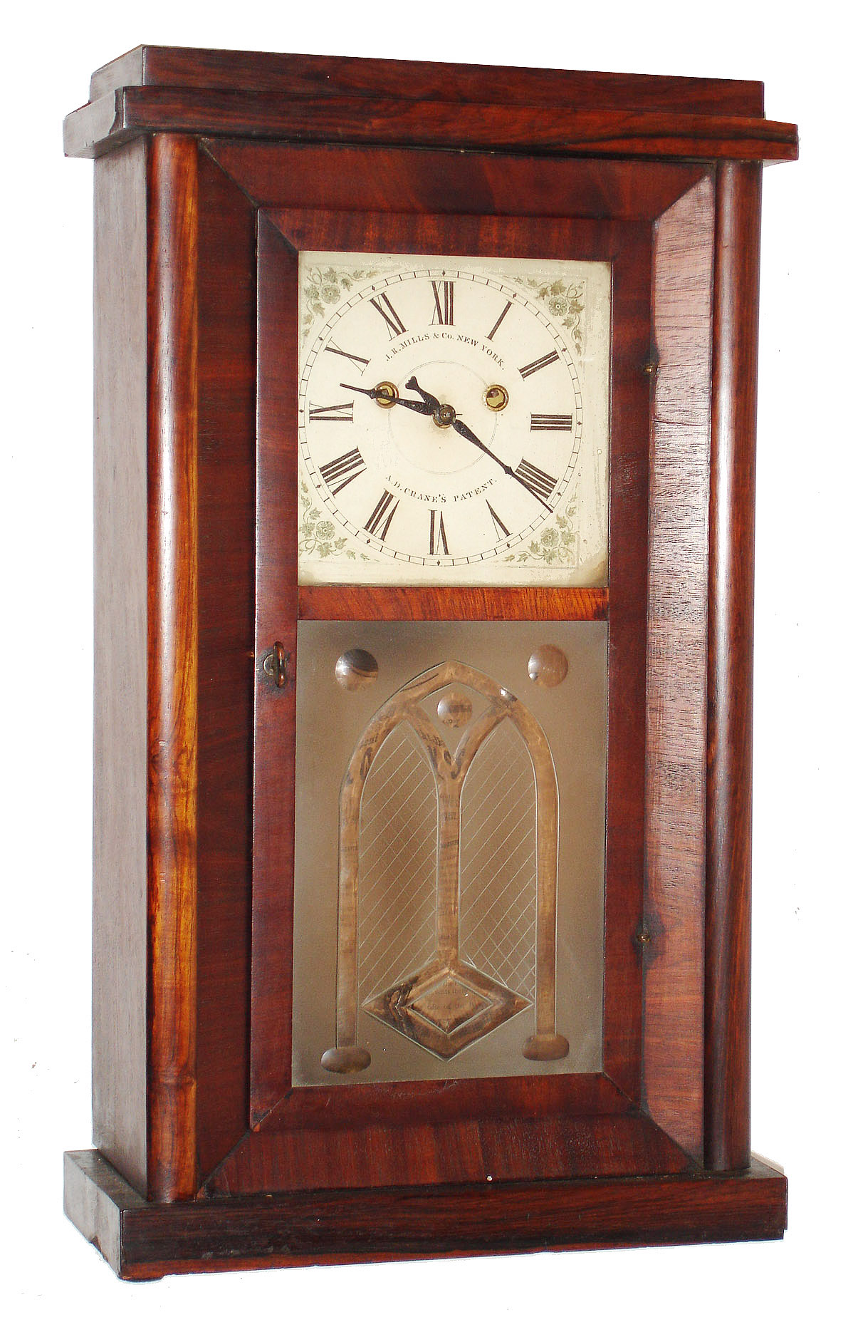 J. R. Mills and Co., New York, Crane's Patent, 8 day, time and strike, two weights three ball rotary pendulum shelf clock. c1846.  This model was made in Bellesville, New Jersey and sold by the Year Clock Co. from its store in New York.  The J.R. Mills &amp; Co. was located in Bellesville. Examples of the case with pictures of the movement can be found in: "NAWCC supplement 16, summer 1987, Aaron Dodd Crane, An American Original", pg 71. — Antique Clocks Price Guide