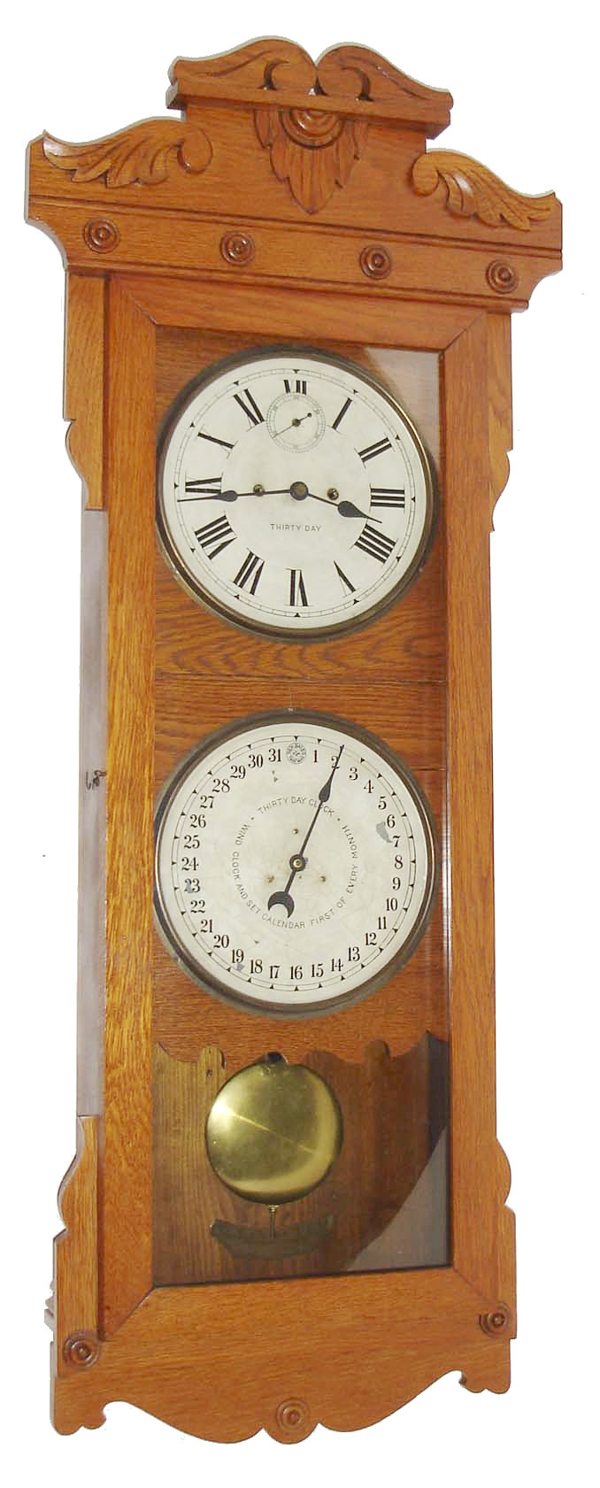 New Haven Clock Co., New Haven, Conn., for the American Wringer Co., New York,  30 day, spring double dial wall calendar timepiece. c1900 — Antique Clocks Price Guide
