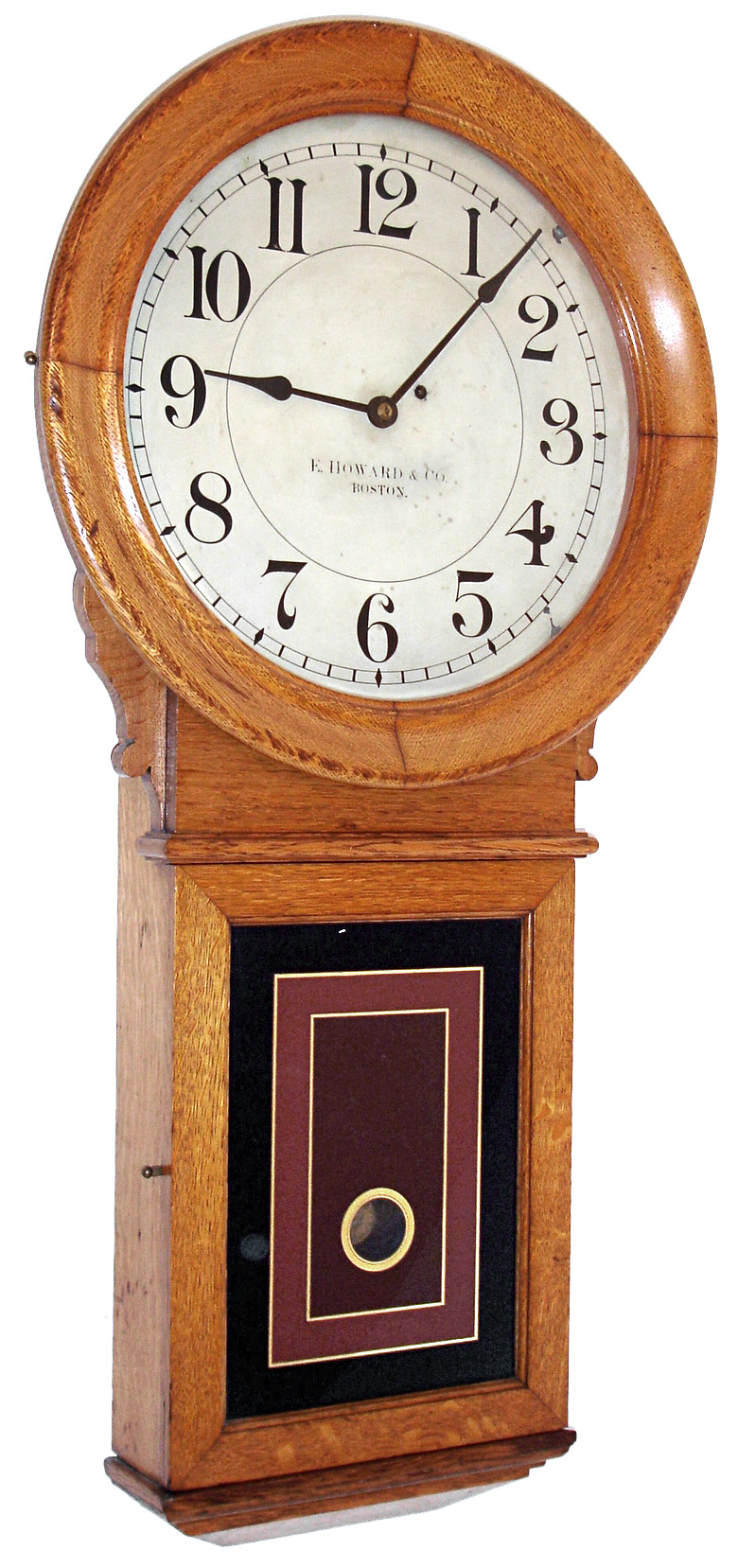 E. Howard &amp; Co., Boston, Mass., "No. 70 Regulator" with 16" dial, wall clock, 8 days, time only, weight driven movement in an oak case with painted metal dial and reverse painted lower tablet, c1890 — Antique Clocks Price Guide