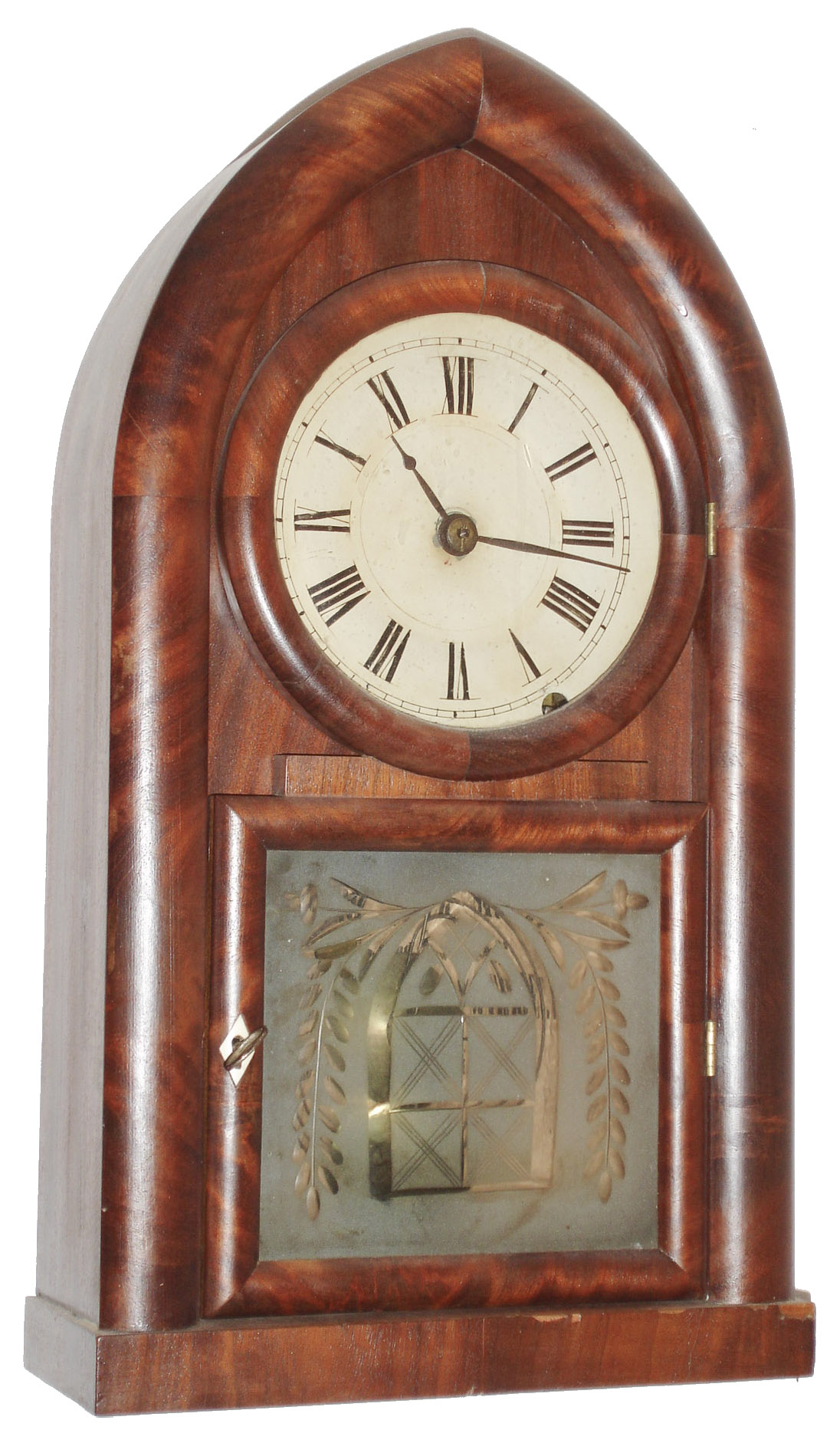 Brewster and Ingrahams, Bristol, Conn., 8 day, time and strike, mahogany round gothic or beehive shelf clock.  This example was exported to England and has an overpasted label that reads: "Warranted Brass Clocks sold by J. Giscard, Watch and Clock Maker, Silversmith and Jeweler, High Street, Downham Market, Agent for the Western Life Office". c1850 — Antique Clocks Price Guide