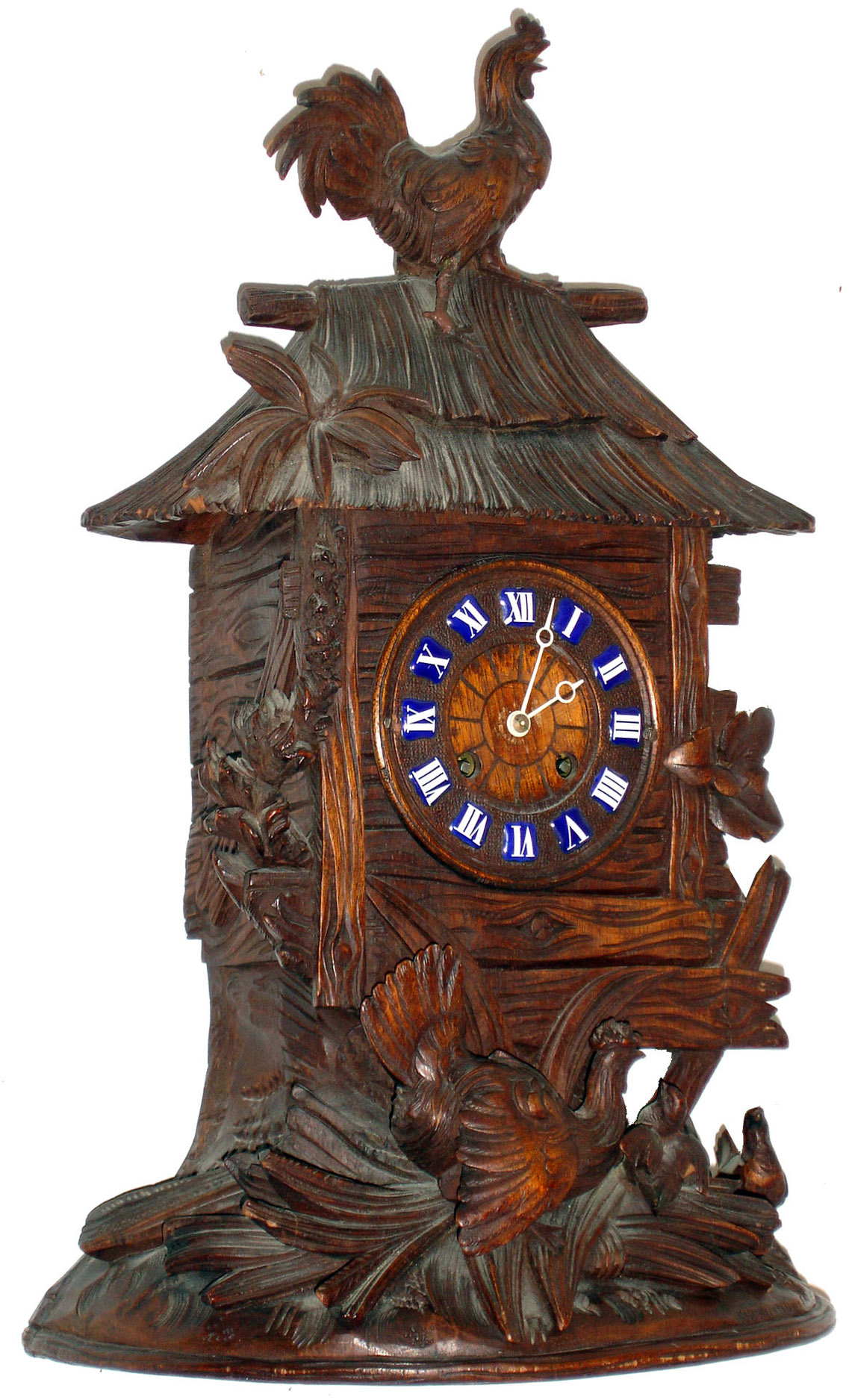Swiss mantel clock, Japy Freres 8 days, time and strike, movement, back plate also marked "M.R. &amp; Co.", in a beautifully carved Swiss case, a rooster atop shed with thatch roof, the hen below in foliage feeding her young, wooden dial with blue enamel cartouche Roman numerals, Breguet style hands, c1880 — Antique Clocks Price Guide