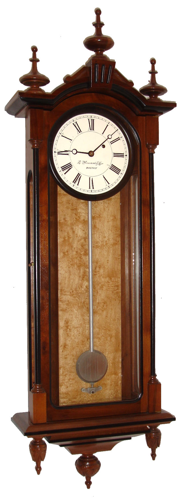 E. Howard &amp; Co., Boston, Mass., "Regulator No. 59-8" reissue, wall clock, 8 days, time only, weight driven movement in a walnut and ebonized case with bird's eye maple weight baffle, three carved lower finials and 8" painted metal dial, dated 1976 — Antique Clocks Price Guide