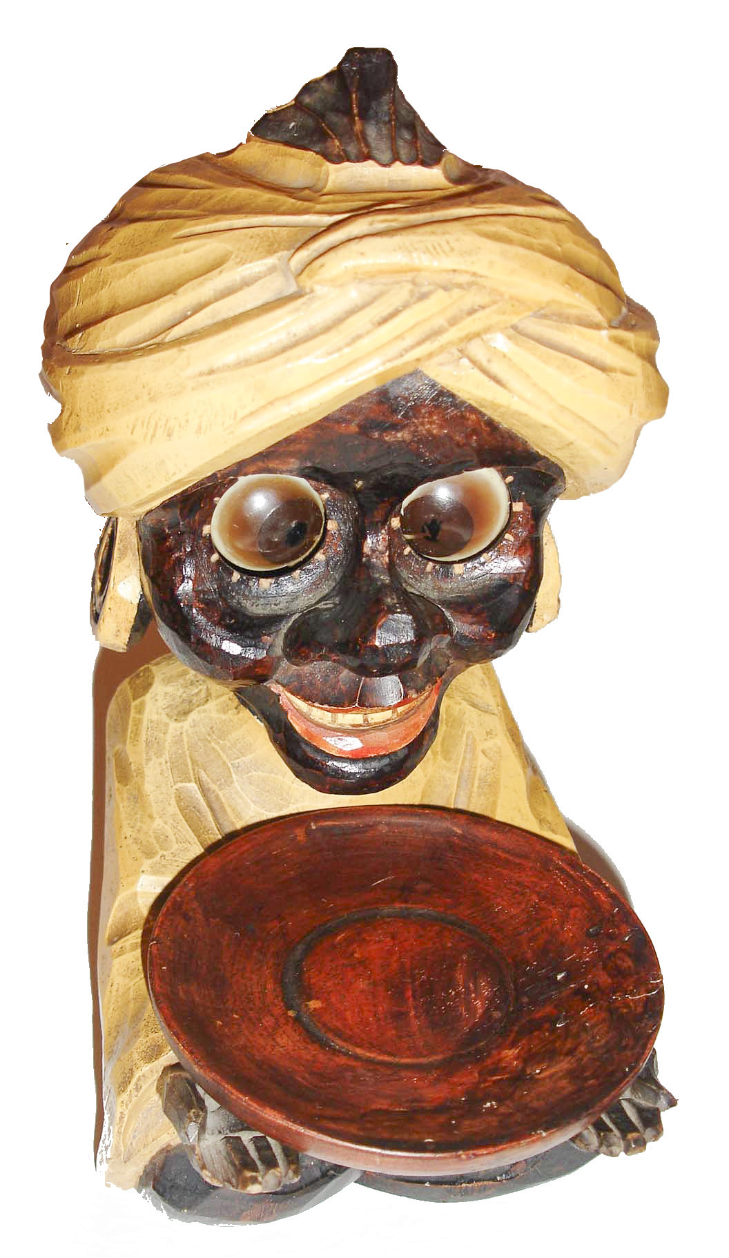 Oswald, Germany, "Sheik" cast composition rotating eye novelty clock, seated dark skinned figure with large earrings and turban, with arms extended and holding a round tray, c1950 — Antique Clocks Price Guide