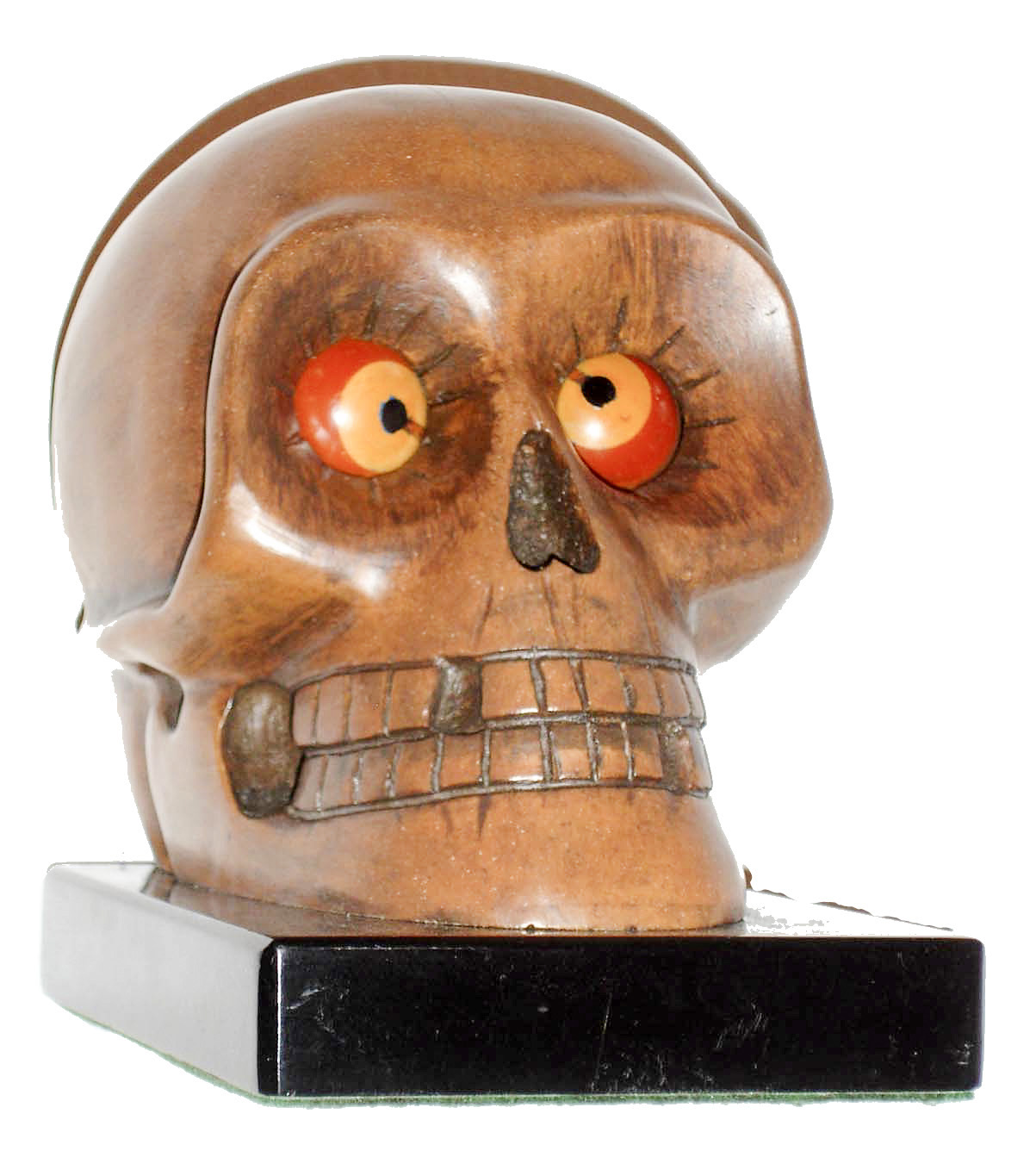 Germany, possibly Oswald, "Skull" rotating eye novelty clock, the brown composition skull with 30 hours, time only, movement, red and yellow eyes, the back marked "Patented U.S.A. Aug. 31 1926 Made in Germany No Jewels", on a polished ebonized base, c1930 — Antique Clocks Price Guide