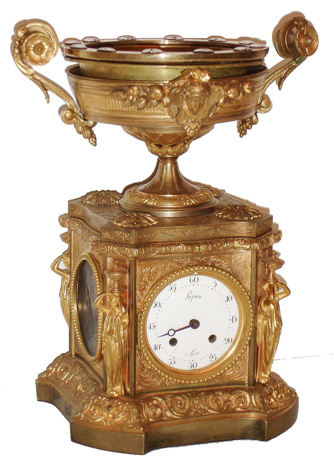 Popon, Paris, France, rare annular mystery clock, in a gilt bronze case, the molded base with Adamesque style scrolled vines with bellflowers, the sides with patinated plaques depicting children at play, the other with figures and a musician in a wooded landscape, the plaques set into panels with engraved foliage, corners with standing female figures carrying urns on their heads, below a platform with compote having scrolled handles and leaves and central mask, containing a rotating bowl set with Roman numeral enamel plaques indicating the hours, the minutes shown on the white enamel Arabic numeral dial in the case front signed "Popon a Paris", beaded hinged bezel, single blued steel Breguet style hand, and signed 8 days, time and count wheel strike pendule a Paris movement, sounding on a bell, with beveled gearing connecting the hour wheel to a cradle with the rotating bowl above, c1870 — Antique Clocks Price Guide