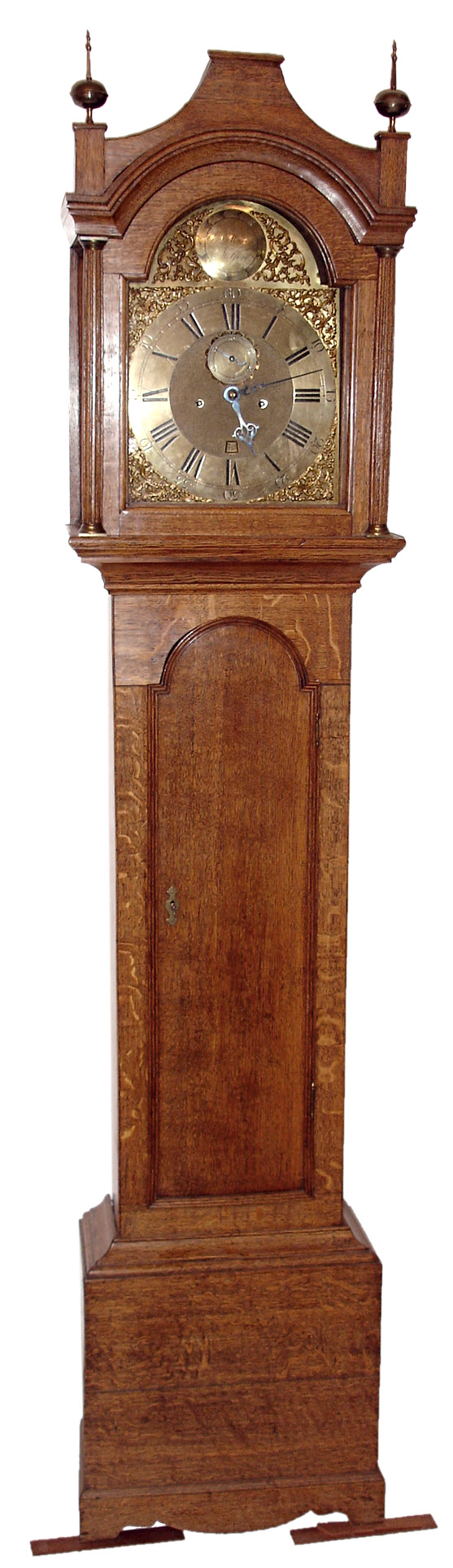 George Maynard, Medford, England tall clock, 8 days, time, calendar and bell strike, weight driven movement in an oak case with brass dial and spandrels, c1770 — Antique Clocks Price Guide