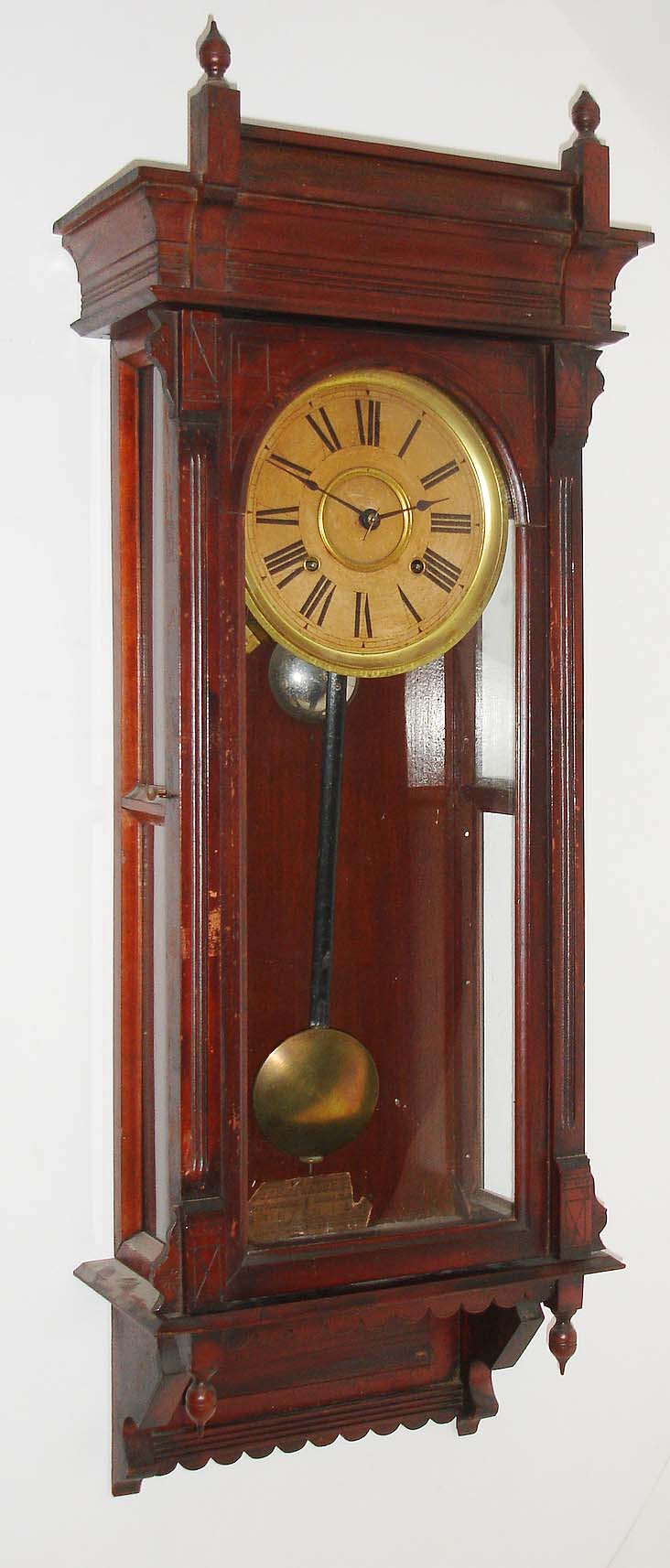 Terry Clock Co., Pittsfield, Mass., "Garland", 8 day, time and strike, spring driven wall regulator, c1885.  This clock was later sold by Russell &amp; Jones who took over the Terry Clock Co. when it failed in 1888.  A picture of this clock can be found in: "Calendar Clocks" by Tran Duy Ly, pg 225. — Antique Clocks Price Guide