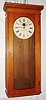 E. Howard & Co., Boston, Mass., "Regulator No. 89" wall clock, time only, self-winding electric movement in an oak case with painted metal dial, c1925
