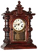 Welch, Spring, & Co., Bristol, Conn., "Patti No. 2", shelf clock, 8 days, time only, double spring driven, nickel plated movement in a rosewood case with papered metal dial and silk screened front tablet and clear glass sides, c1889