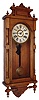 Ansonia Clock Co., Brooklyn, New York, "Queen Elizabeth", wall clock, 8 days, time and strike, spring driven movement in an oak case with paper over metal dial, c1890
