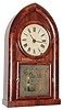 Brewster and Ingrahams, Bristol, Conn., 8 day, time and strike, mahogany round gothic or beehive shelf clock.  This example was exported to England and has an overpasted label that reads: "Warranted Brass Clocks sold by J. Giscard, Watch and Clock Maker, Silversmith and Jeweler, High Street, Downham Market, Agent for the Western Life Office". c1850