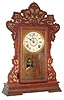 Seth Thomas Clock Co., Thomaston, Conn., "Color Series", 8 day, time and strike, oak case kitchen clock. We could not find this exact model in the catalog , but similar examples are found in the color series produced by Seth Thomas, c1900