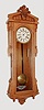 Ansonia Clock Co., Brooklyn, New York, "Bagdad", wall clock, 8 days, time only, two weight driven movement in an oak case with papered metal dial and second's bit, c1890