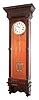 Waterbury Clock Co., Waterbury, Conn., "Regulator No. 12", wall clock, 8 days, time only, weight driven Swiss movement with two glass vial mercury pendulum, sweep seconds and pinwheel escapement in an oak case with white enamel dial, c1890