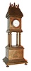Desk clock, heavy brass case in the form of a clock tower, square molded base with relief of St. George slaying a dragon, the base with 4 columns supporting the upper portion, with rope molded bezel and convex glass, containing a 17 jewel Waltham model 1899 watch movement, the roof covered in brass "tiles", and the top with short, lightning rod style ornaments, c1900