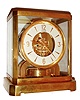 LeCoultre, Switzerland, Atmos clock, gilt calibre 519 movement, round white dial with gilt trim, numerals and hands, polished gilt case with glass top and sides, serial #44963, c1950