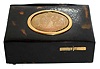 Singing bird box tabatiere, French or German, tortoise shell case with compartment for snuff or to keep the key, and gilt cover, engraved with a scene of a well dressed couple, their estate in the background, giving coins to the poor, the bird with orange, red, blue, green, and black feathers emerges and does his routine when the start slide is pushed, all on silver ball feet, c1890