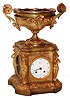 Popon, Paris, France, rare annular mystery clock, in a gilt bronze case, the molded base with Adamesque style scrolled vines with bellflowers, the sides with patinated plaques depicting children at play, the other with figures and a musician in a wooded landscape, the plaques set into panels with engraved foliage, corners with standing female figures carrying urns on their heads, below a platform with compote having scrolled handles and leaves and central mask, containing a rotating bowl set with Roman numeral enamel plaques indicating the hours, the minutes shown on the white enamel Arabic numeral dial in the case front signed "Popon a Paris", beaded hinged bezel, single blued steel Breguet style hand, and signed 8 days, time and count wheel strike pendule a Paris movement, sounding on a bell, with beveled gearing connecting the hour wheel to a cradle with the rotating bowl above, c1870