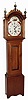 Country tall clock, 30 hours, time and strike, wooden works movement with painted wooden dial, c1830 in a contemporary pine case with tiger maple highlights on trunk and hood by Frasier Forge of Fryeburg, Maine, c1985