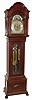 Tall clock, Germany retailed by W.K. Cowan & Co., Chicago, 8 days, time, strike, moon phase and chime on marked Herschede Crown Symphony tubes, three brass weight driven movement in a mahogany case with beveled lower glass, paw feet and sunburst on lower plinth and brass dial with silvered chapter ring and strike / silent selection, c1915