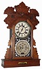 Charles W. Feishtinger, Fritztown, Penn., 8 days, walnut time and strike, double dial calendar gingerbread mantel clock, c1894