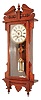 Waterbury Clock Co., Waterbury, Conn., "Eton", 8 day, time and strike, walnut wall clock. c1906.