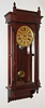 Terry Clock Co., Pittsfield, Mass., "Garland", 8 day, time and strike, spring driven wall regulator, c1885.  This clock was later sold by Russell & Jones who took over the Terry Clock Co. when it failed in 1888.  A picture of this clock can be found in: "Calendar Clocks" by Tran Duy Ly, pg 225.