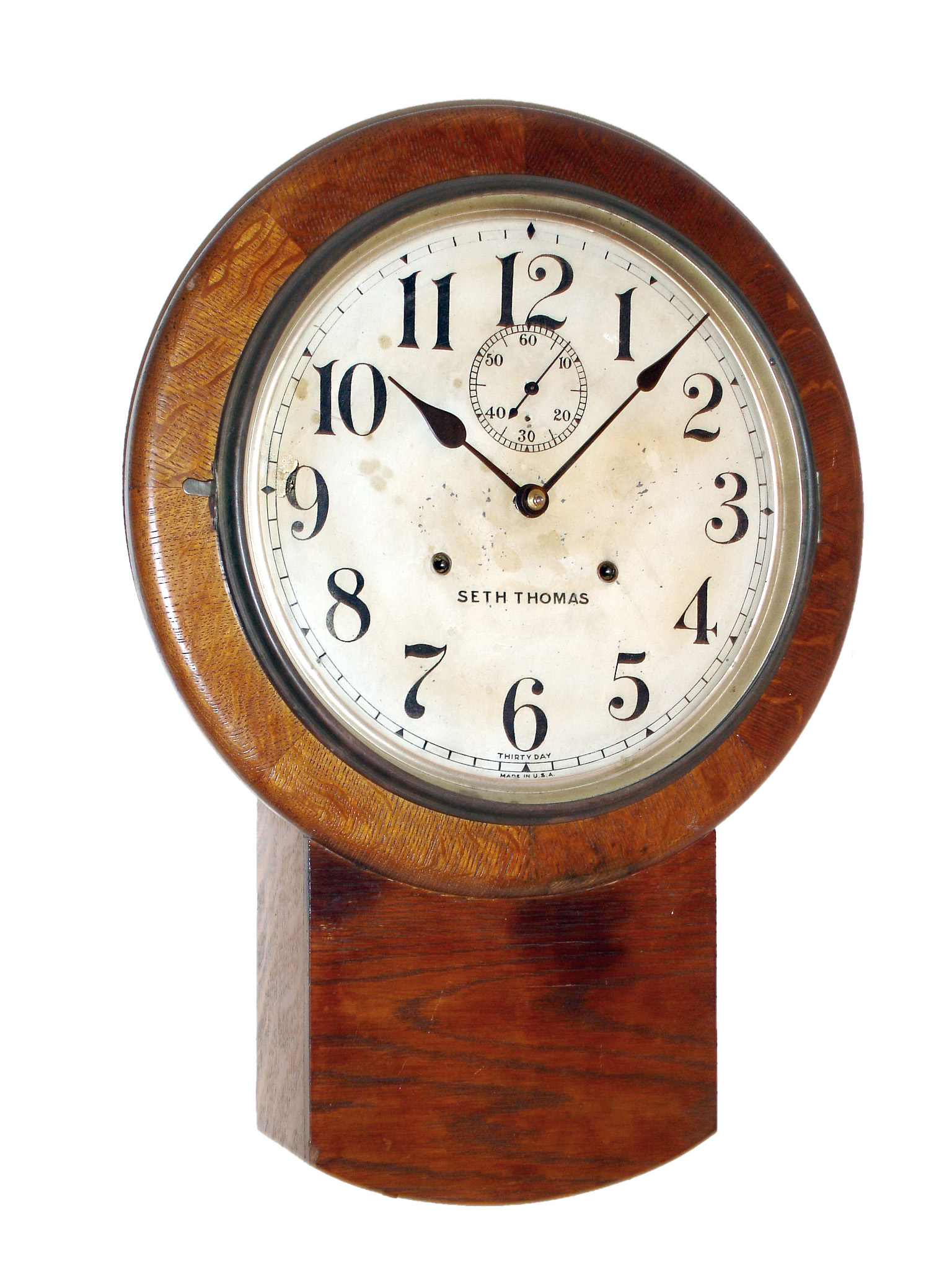 Seth Thomas Clock Co., Thomaston, Conn., "Bradford" 30 day time only solid oak wall clock, c1922 — Antique Clocks Price Guide